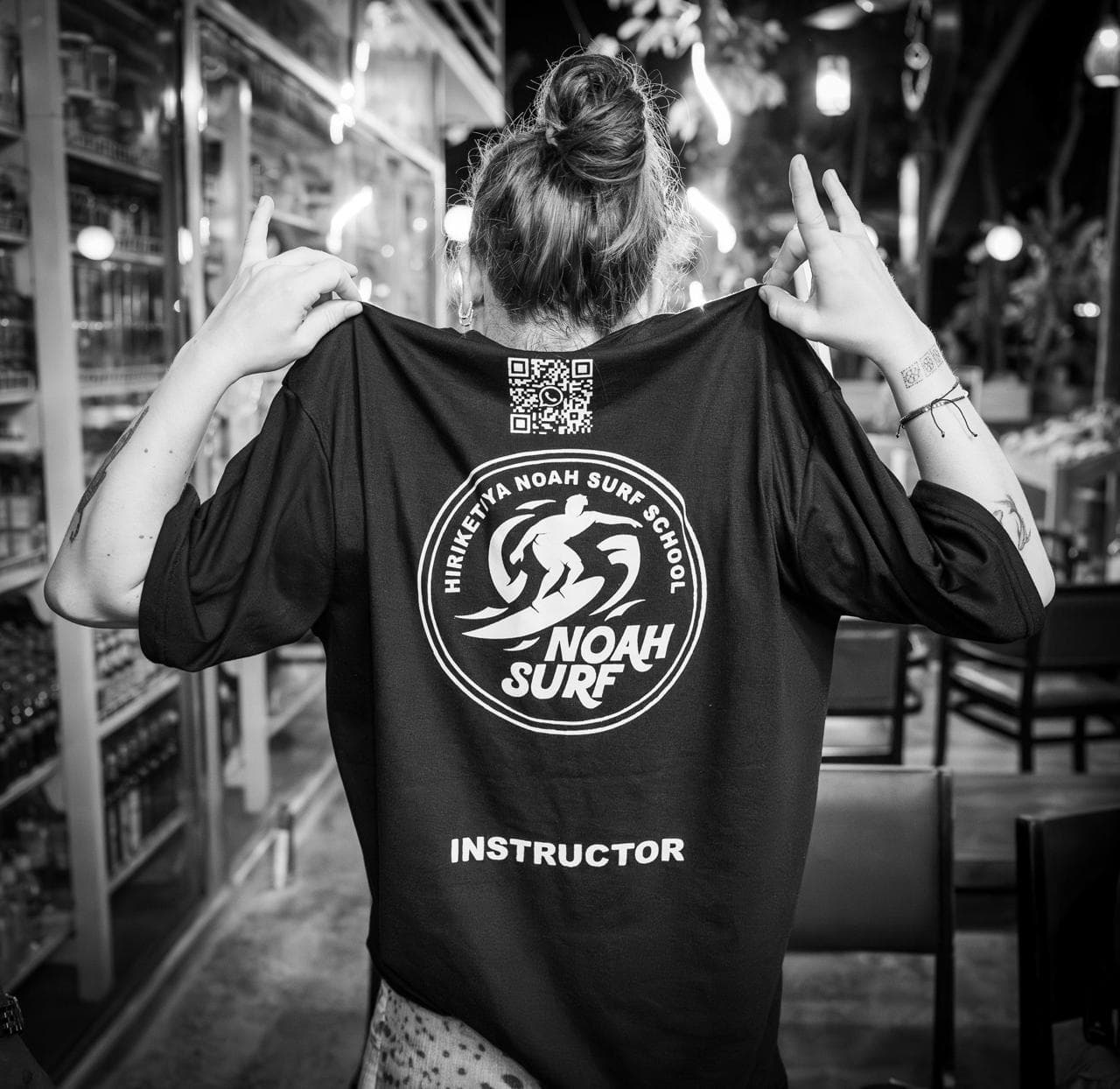 Instructor wearing a Noah Surf School tee