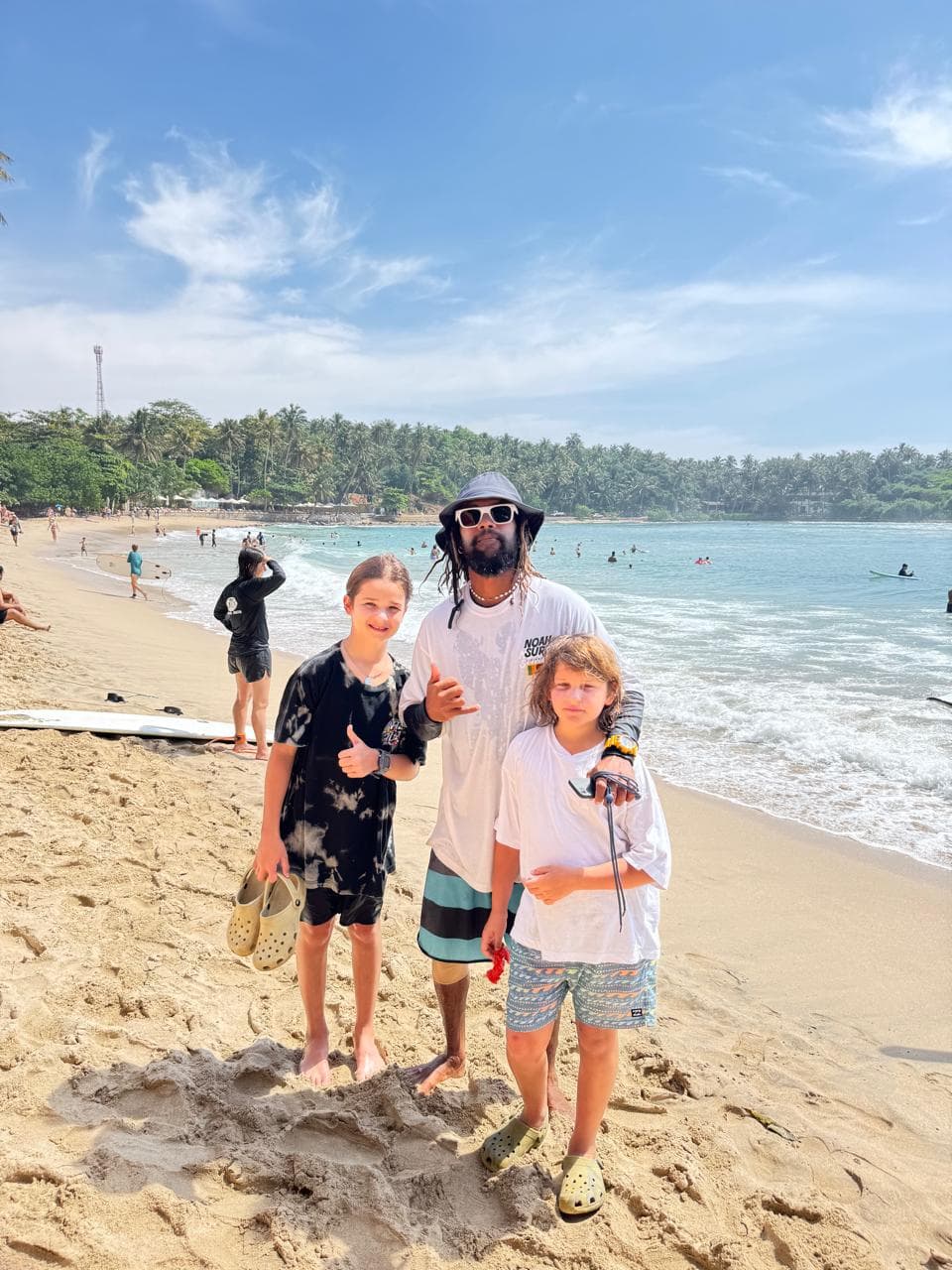 Instructor teaching kids to surf