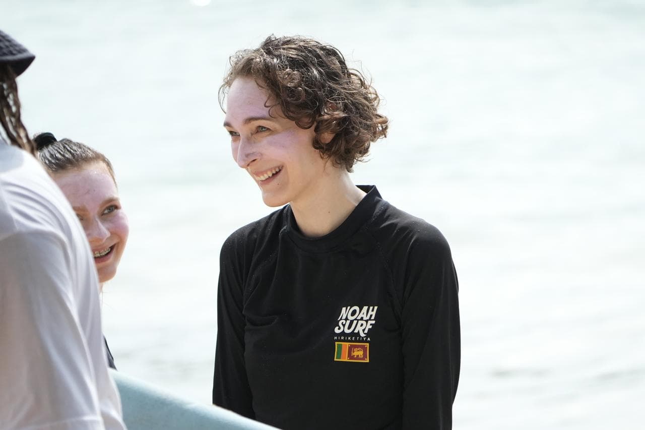 Student smiling after a surf lesson